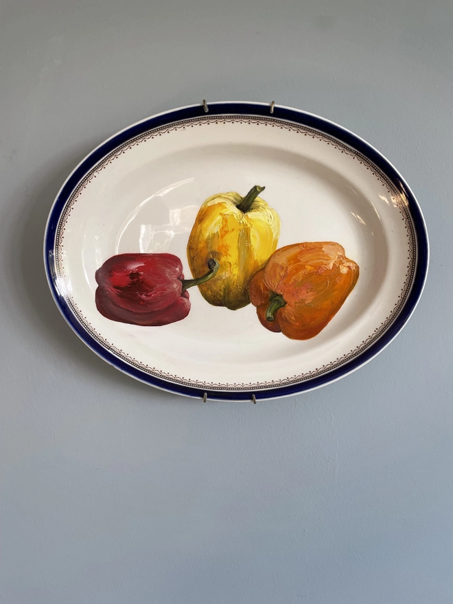 oil painting of 3 peppers on vintage platter