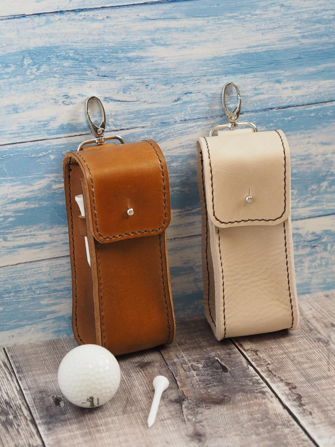 Handmade Leather Golf Ball Carrying Case. Two leather pouches designed to hold golf balls and golfing tees