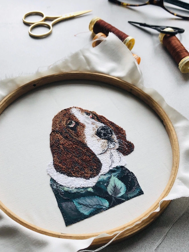 photo shows the making of a small embroidered pet portrait