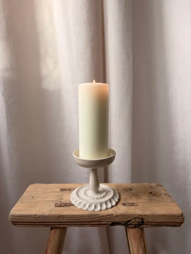 Pillar Candle Holder with Candle on Wooden Stool