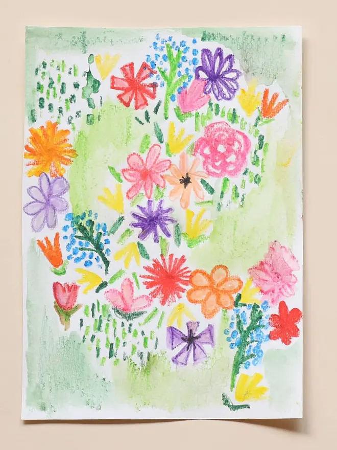 in the garden mini activity box for children. a drawing of assorted colourful flowers.