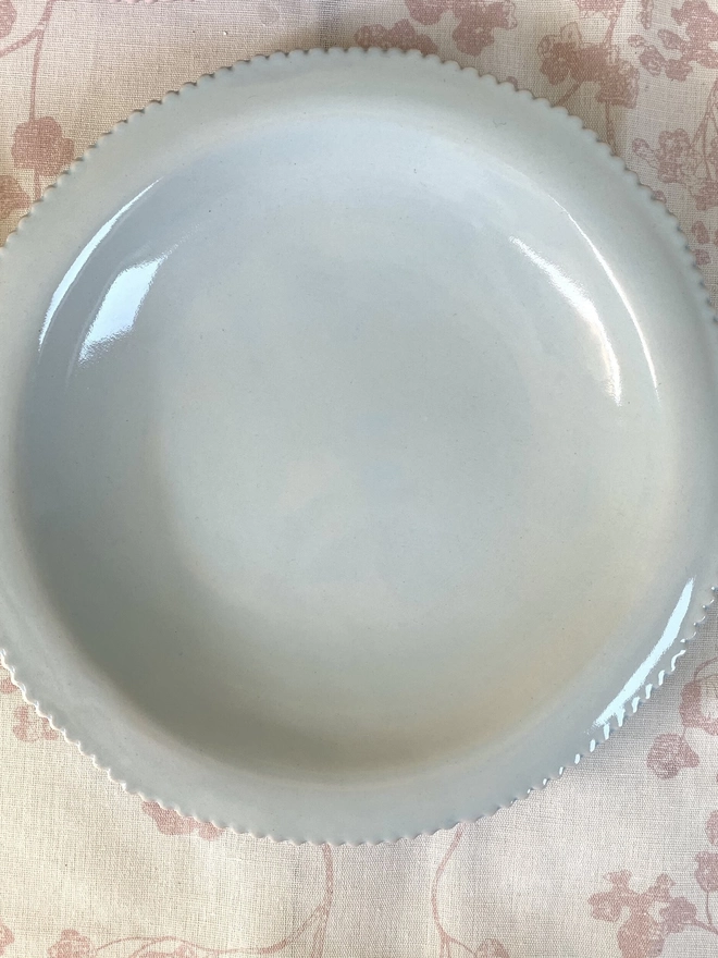 top view of soft blue pasta bowl with scalloped edge