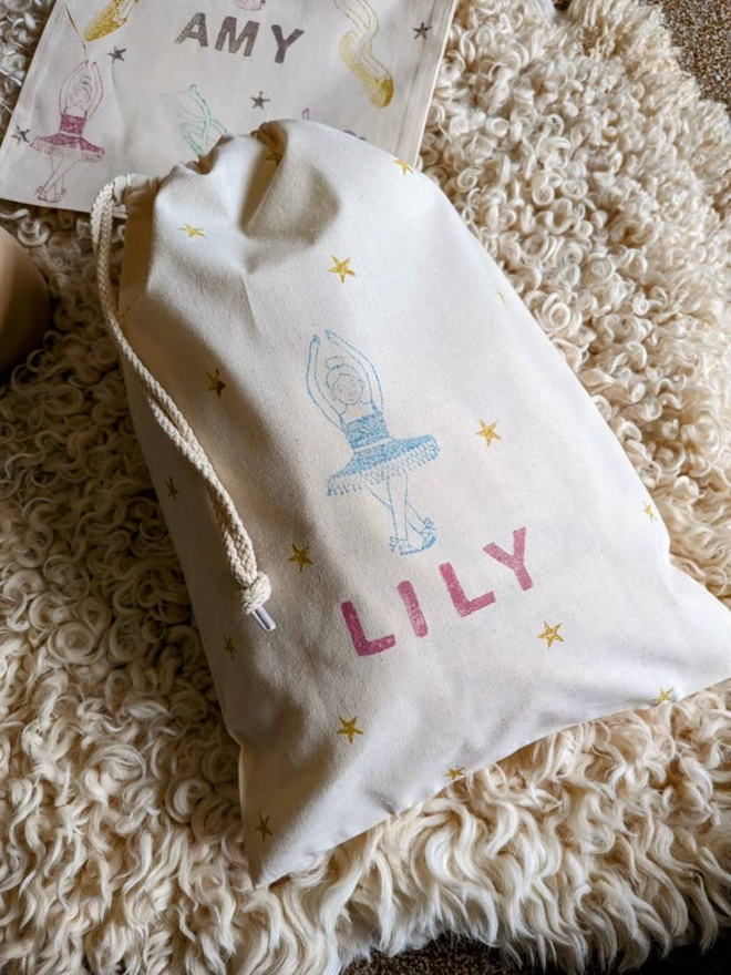 personalised ballet bag. a drawstring ballet bag with a personalised name and printed ballerina.