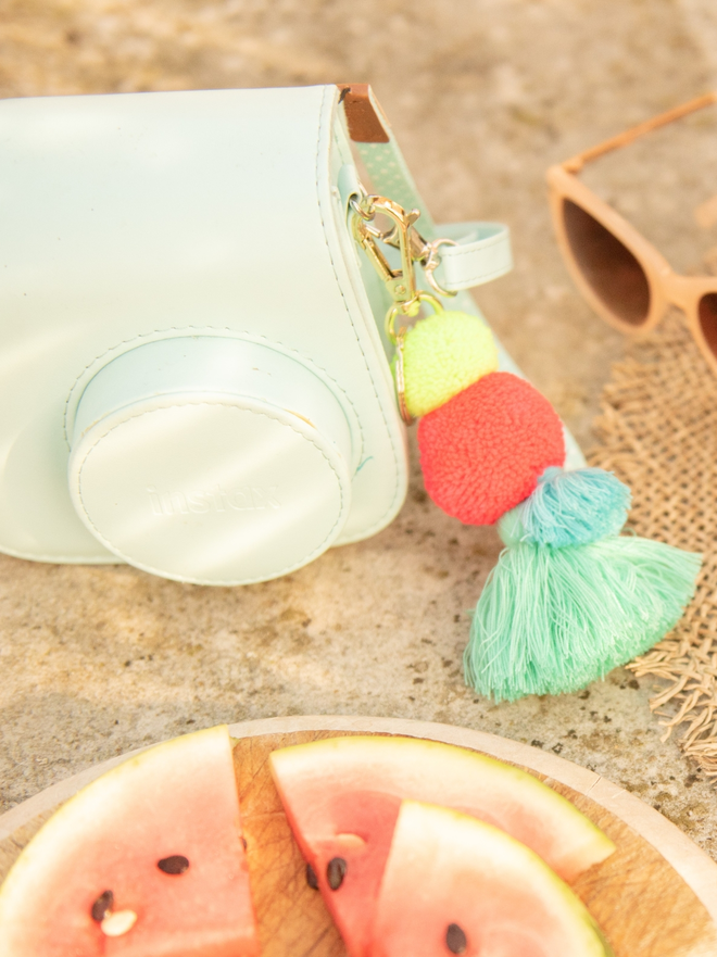 pom pom and tassel keyring bag charm in bright neon colours 