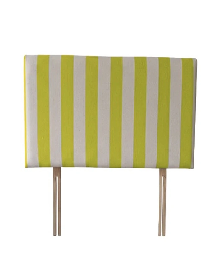 Hand Painted Upholstered Linen Headboard In Stripe Print, a neon yellow striped headboard sitting against a white background. 
