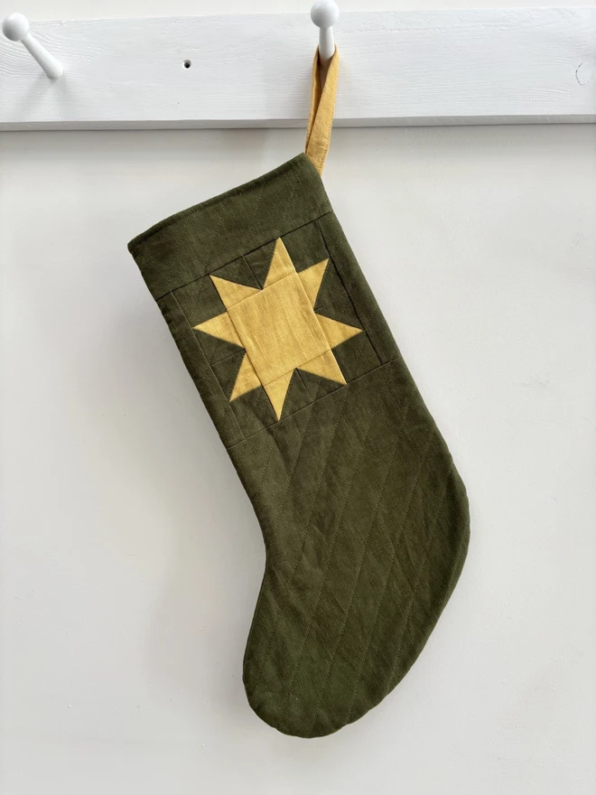 Medium Quilted Linen Star Christmas Stocking in Green Linen with Yellow Linen Patchwork Star Design.
