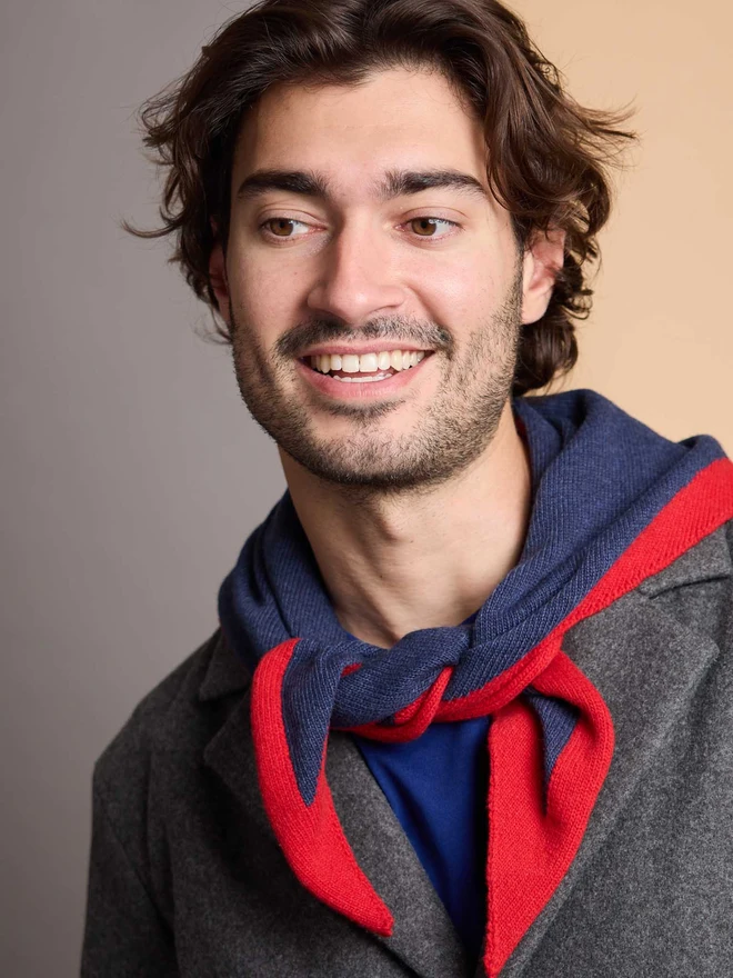 man wearing navy and red wool neckerchief