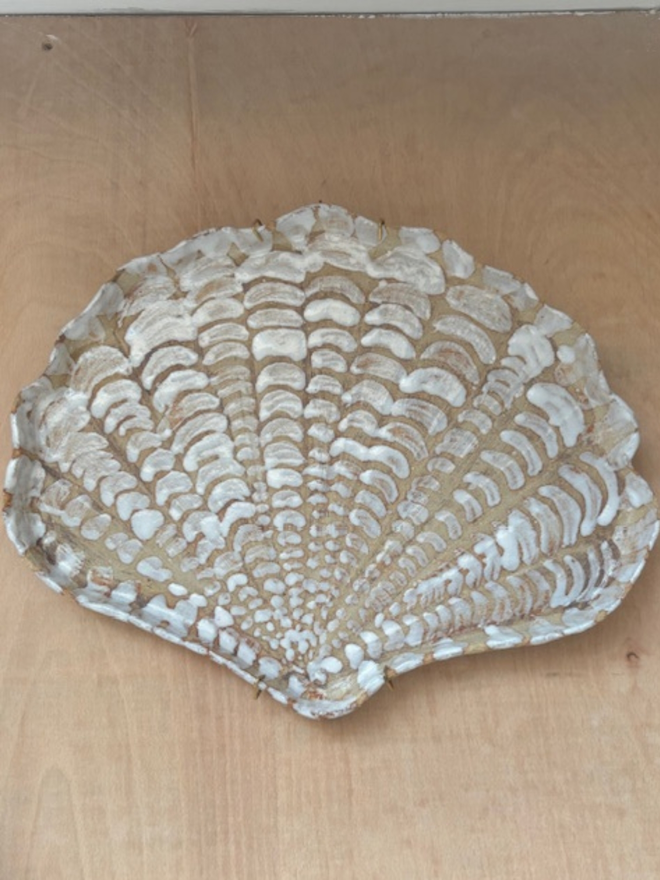 Ceramic shell plate
