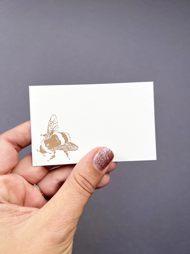 letterpress tiny note illustrated with a gold bumble bee in the corner 