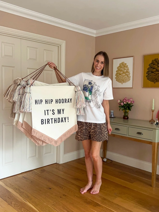 Large handmade fabric birthday banner for birthday celebrations and parties with pastel tassels and rose gold trim 