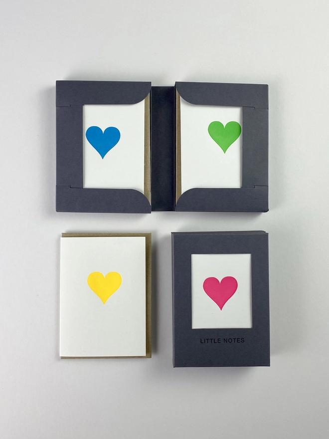 Open and closed gift boxes for little notes allowing you to see three of the four neon heart designs in one box