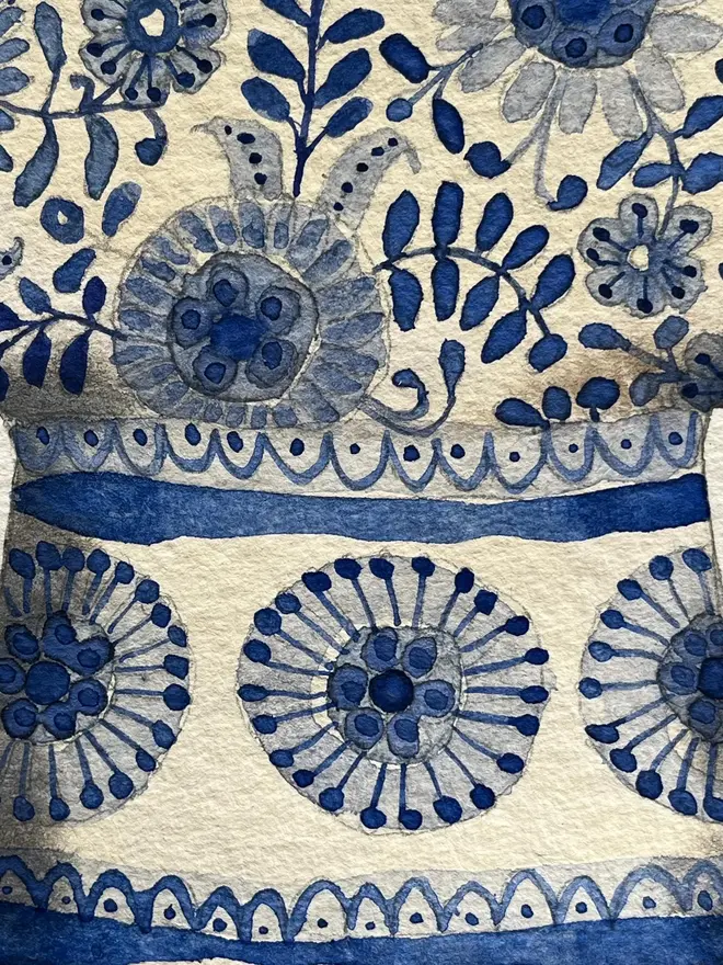 crocus, snowdrops and fritillary flowers in a blue and white, patterned ceramic vessel