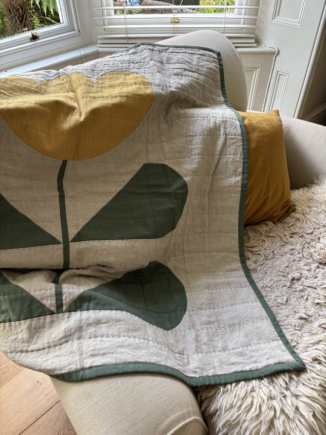 Grow & Bloom Yellow Throw Quilt. A Yellow flower quilt blanket or baby mat.
