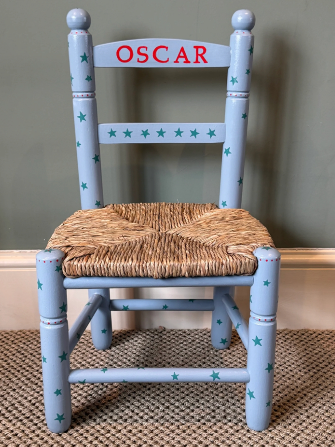 Oscar Hand Painted Chair. A blue chair patterned with darker blue stars.