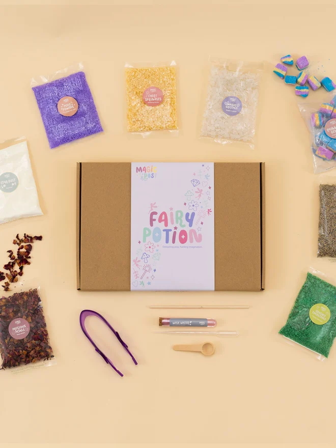 fairy sensory potion kit. nine bags of various sensory materials placed around a cardboard box.