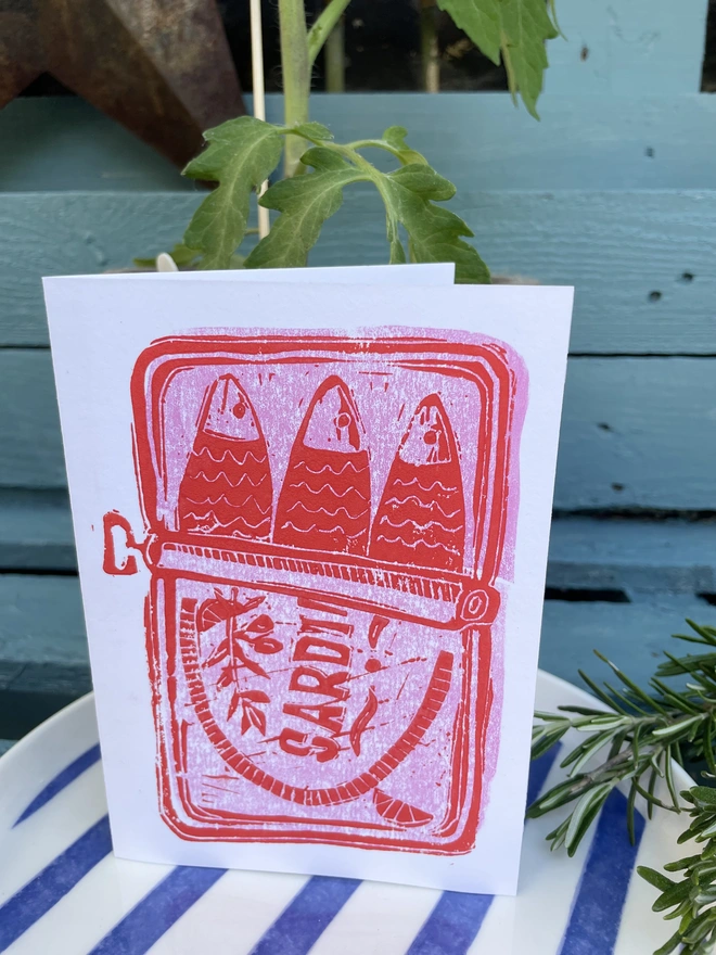 A6 Sardine card hand Lino printed in pop of bright pink and red giving fresh seaside vibe