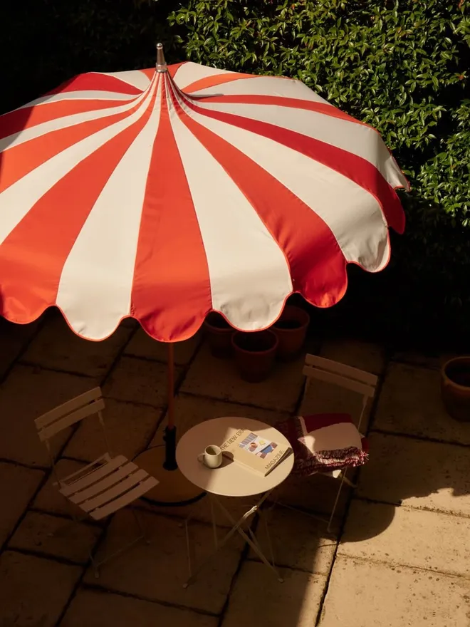 stripe pagoda parasol in garden