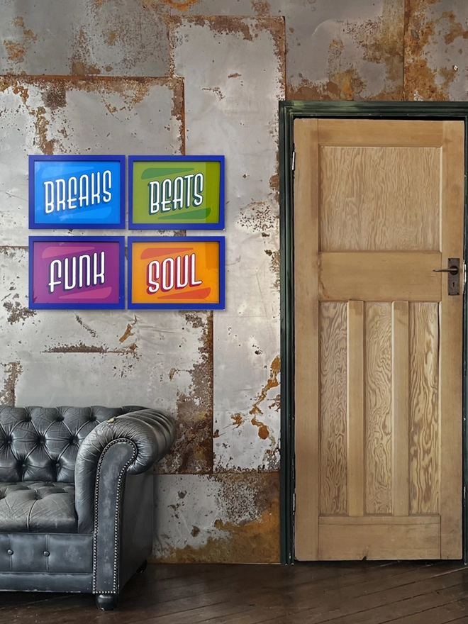 'Breaks, Beats,Funk, Soul' Gold Leaf Glass Artwork, against a metal wall. 