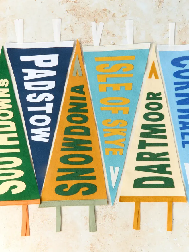 Flat lay of lots of different colours of the custom location flag