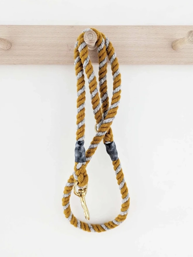 Wool Twist Dog Lead, a wool dog lead hanging on a wooden peg. 