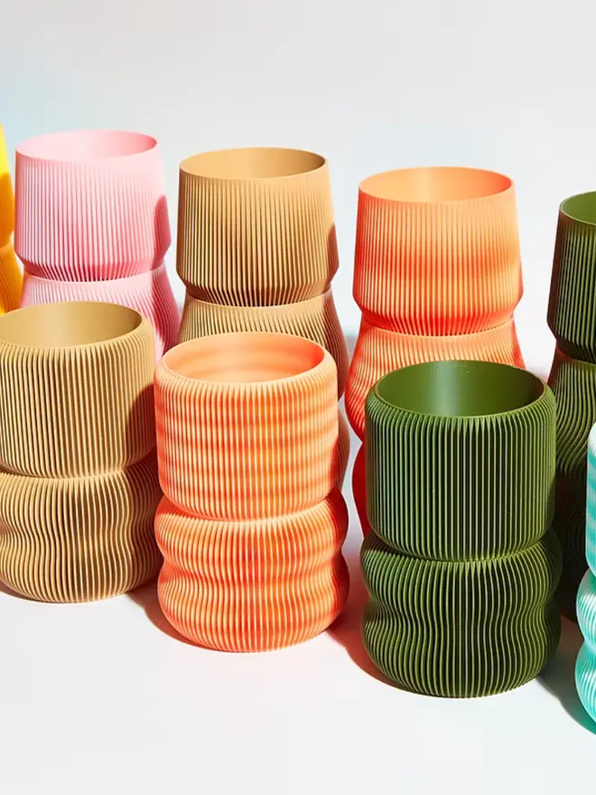 Sustainable 3D Printed Plant Pots stacked on each other, against a white background. 