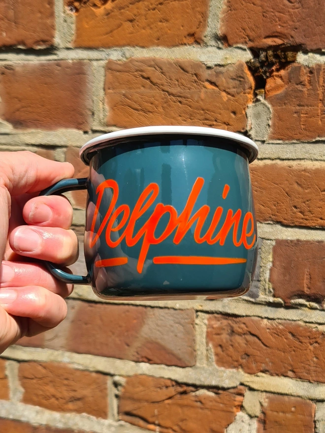Green mug with orange delphine