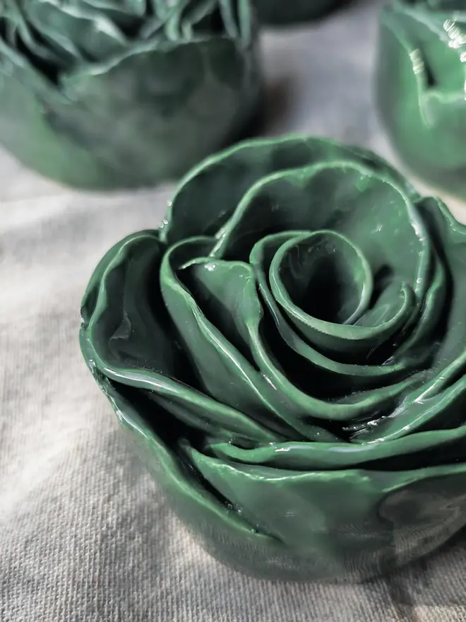 green ceramic rose sculpture
