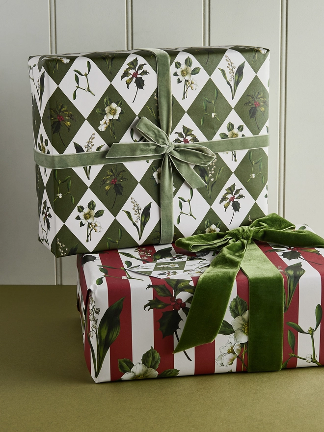 green and ivory harlequin pattern with festive botanicals wrapping paper with co-ordinating red and ivory stripe version