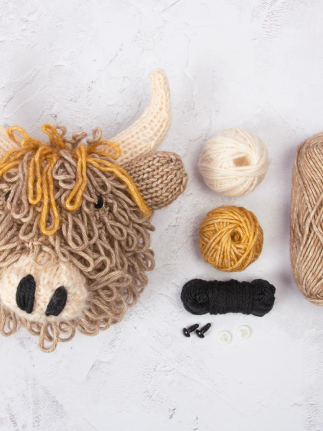 Highland Cow Head Knit Kit. A light brown mini highland cow head with wool.