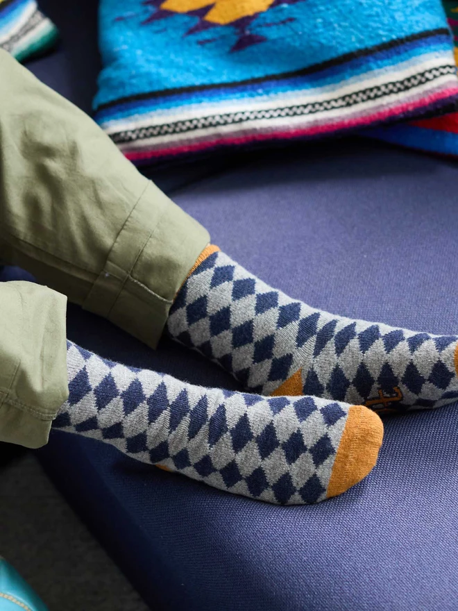 colourful patterned ankle socks, modelled in a colourful room