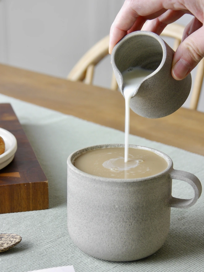 Ceramic Milk Jug grey being used