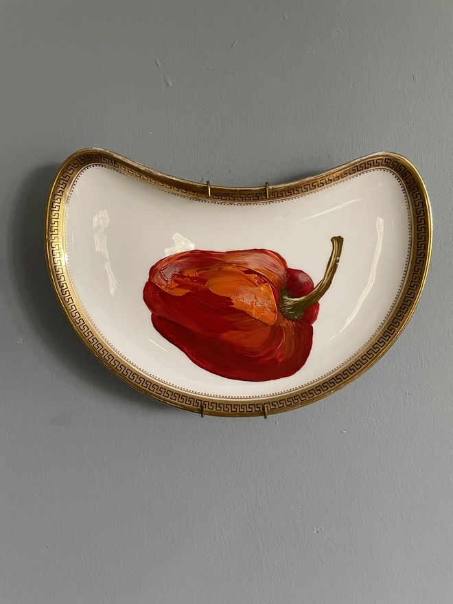 red pepper painting on old plate