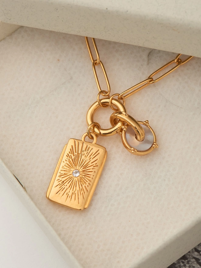 gold necklace with pendants and charms