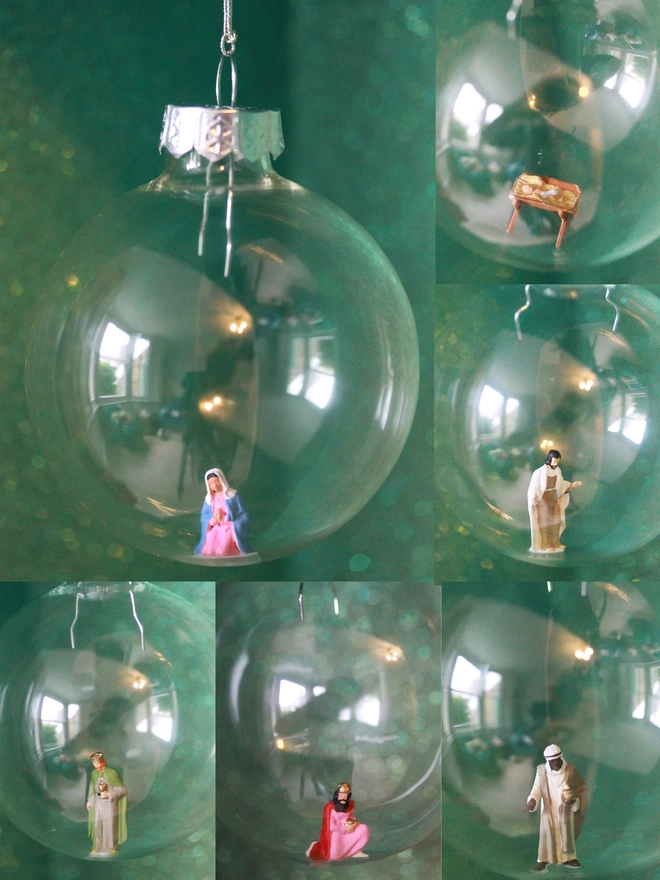Miniature figures of the nativity scene, each in a glass Christmas bauble (part of nativity scene)