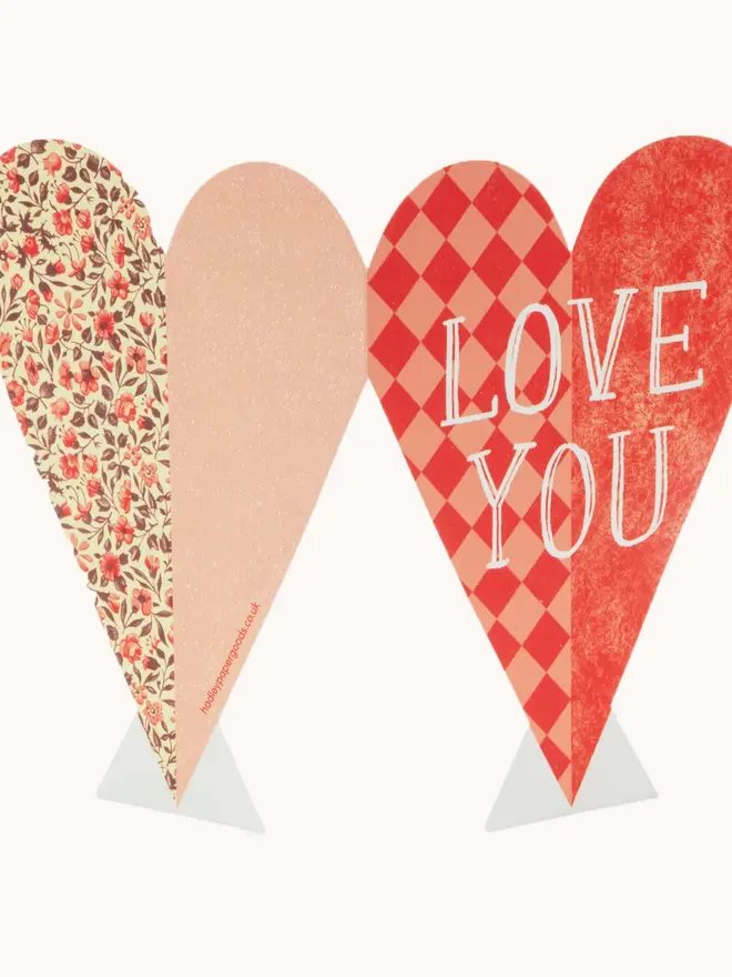 heart shaped red card with 'love you' text