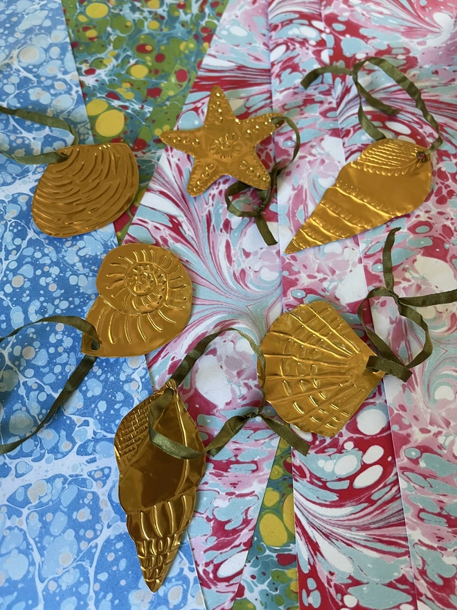 Hand-embossed brass seashell decorations