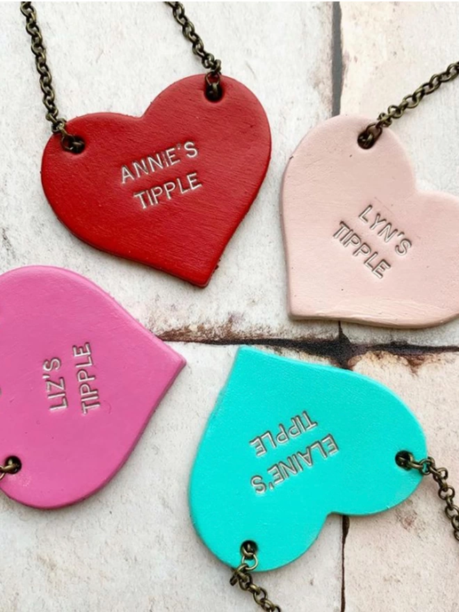 Gifts for friends. Cute heart bottle tags available in mint, hot pink, red or pale pink.
