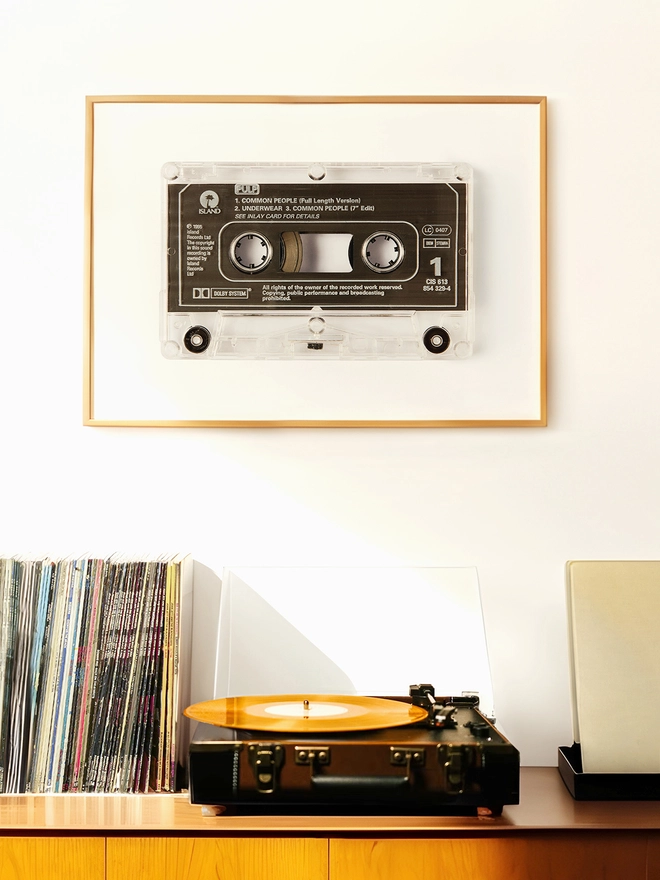 Pulp 'Common People'cassette tape print. framed print hung up above record player and vinyl collection.
