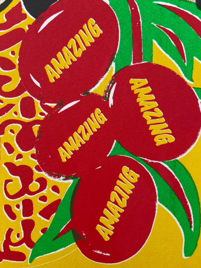Amazing Organic Print. A closeup of the vegetables held by the person. The word AMAZING is on all of the individual fruits.