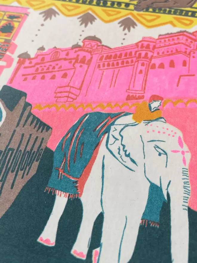 Close-up, detailed shot: up close elephant with pink building in background 