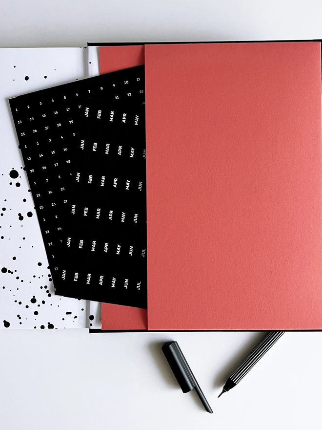 Planner Pocket in Flamingo in the back of a planner