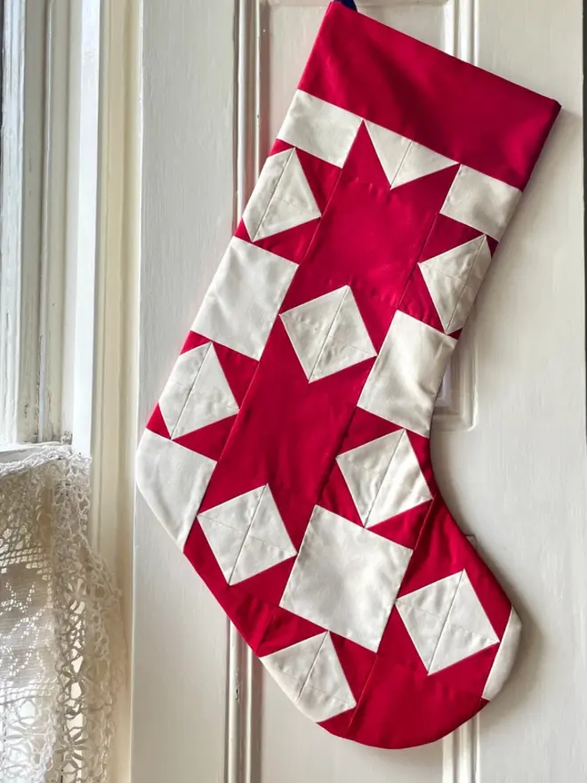 Aster Patchwork Stocking, hanging. 