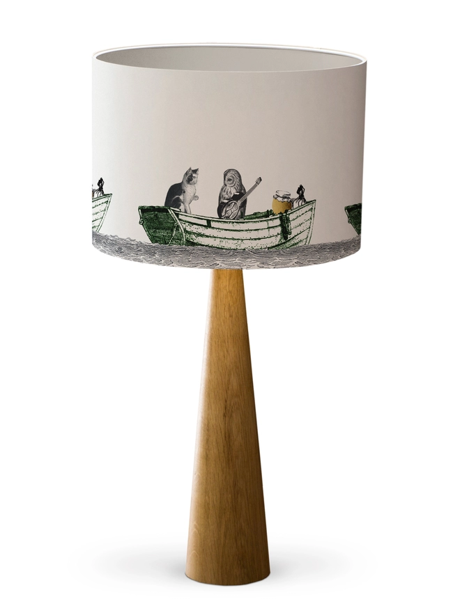 Drum Lampshade featuring the Owl and the Pussycat with a white inner on a wooden base 