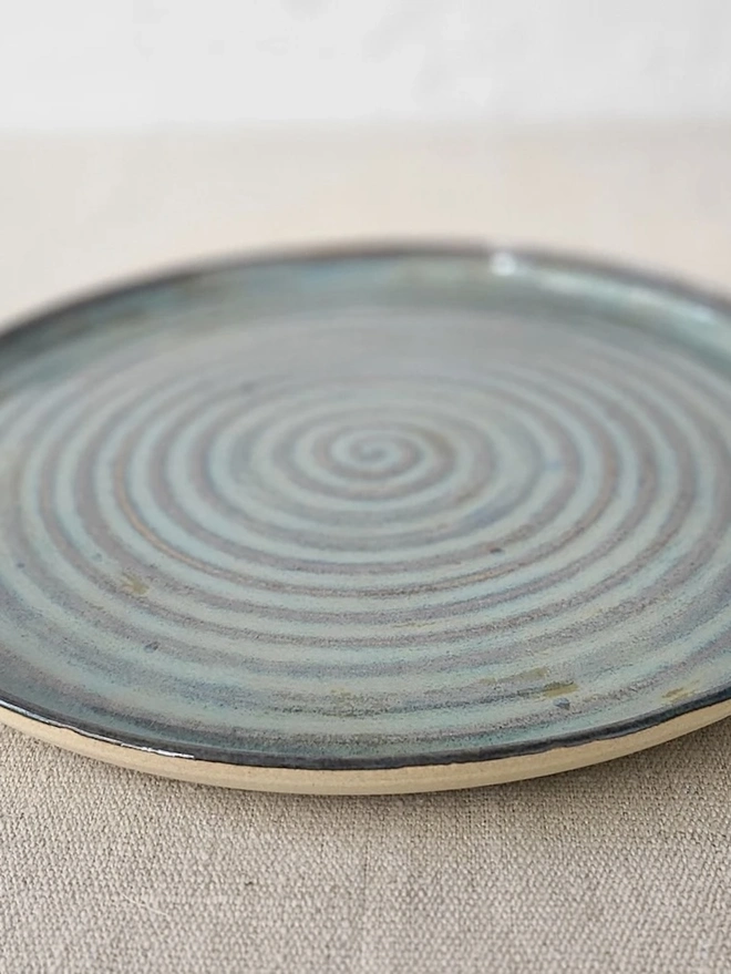 Classic Ceramic Dinner Plate, a colourful ceramic dinner plate sitting on a plain surface against a white backdrop. 