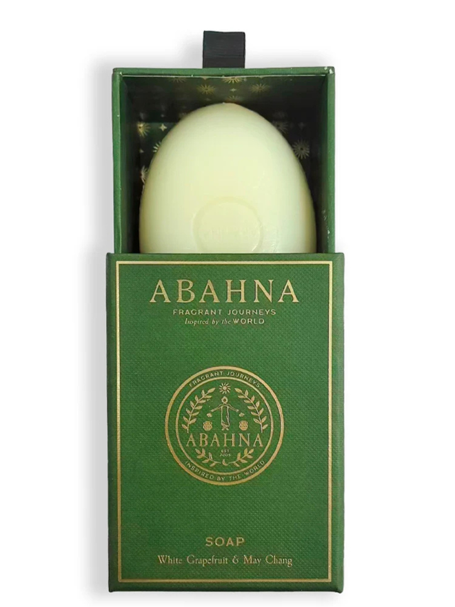 white grapefruit and may chang soap bar. a bar of soap in a lined green box.