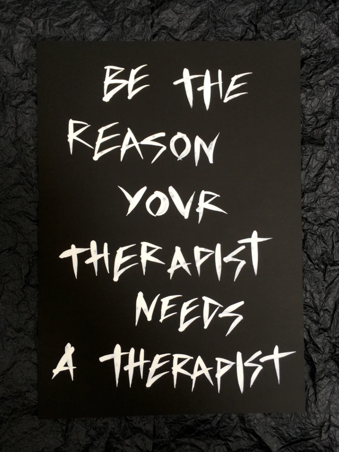 'Be the Reason' painting.  White ink on black paper. 
