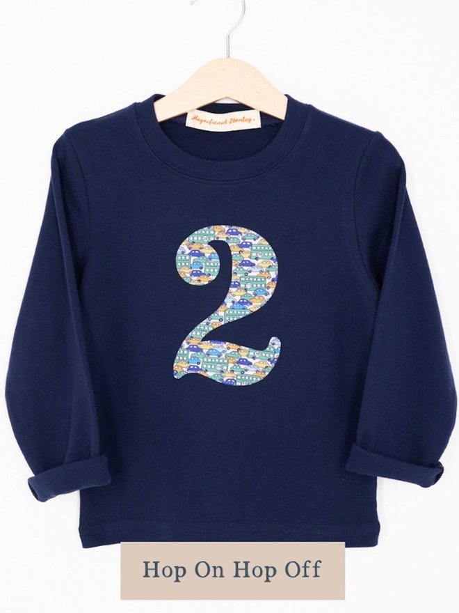 A navy birthday t-shirt with a number 2 cut from liberty car print on the front