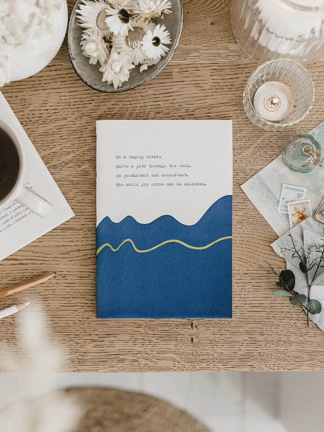 Dark blue and white personalised notebook with a gold wavy line