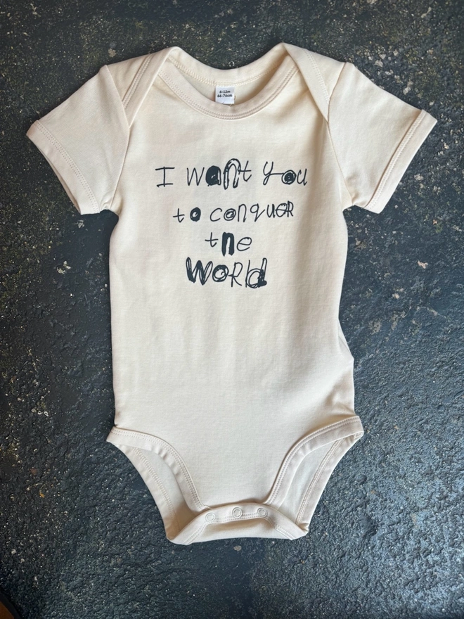 Vanilla off white baby grow with back text in Pipers unique font