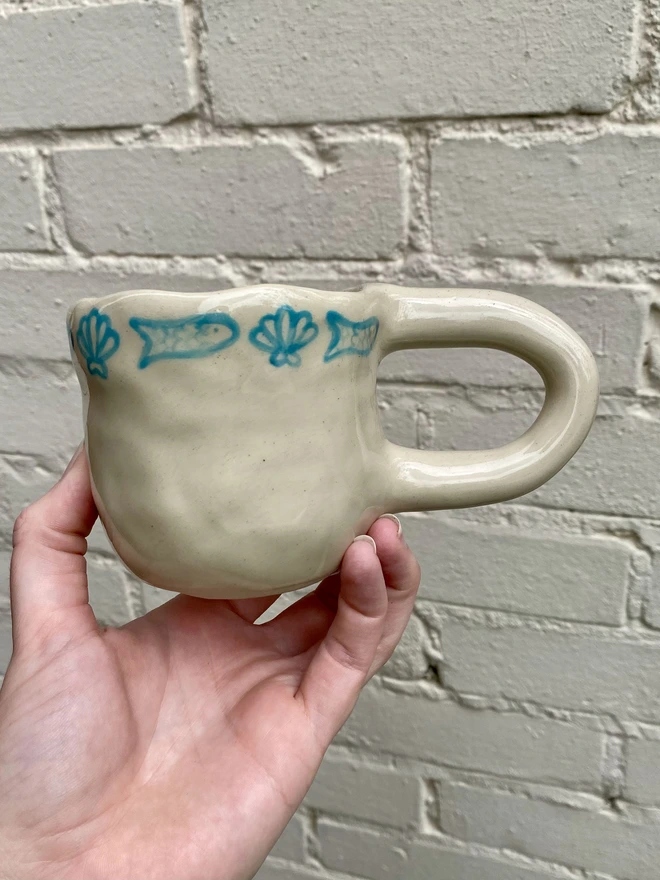 fish and shell mug